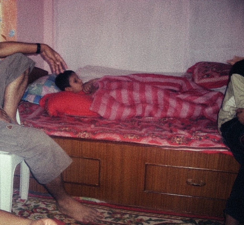 The old film camera resting on our humble bed captured our joys and sorrows. Every click was intentional—precious memories safeguarded carefully in limited film rolls, each image a silent storyteller of our shared struggles and celebrations.